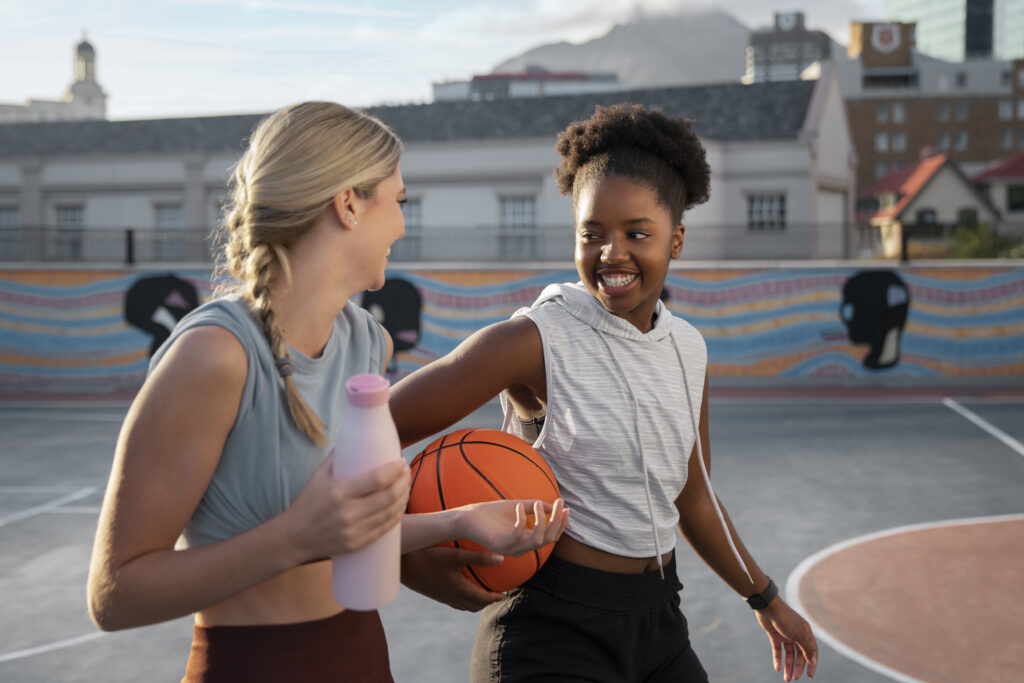 side-view-female-friends-playing-basketball